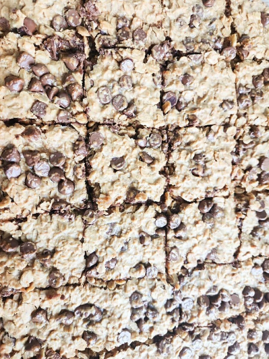 cut granola bars presented in 9x13 pan showing chewy and soft texture